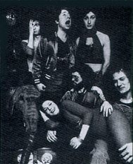 Clockwise from top left Dave Charles, Martin Ace, Vyvyan Morris, Ken Whaley, Malcolm Morley, George Ace. (Richard Treece can just be made out behind Dave Charles)